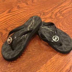Black mk flip flops
